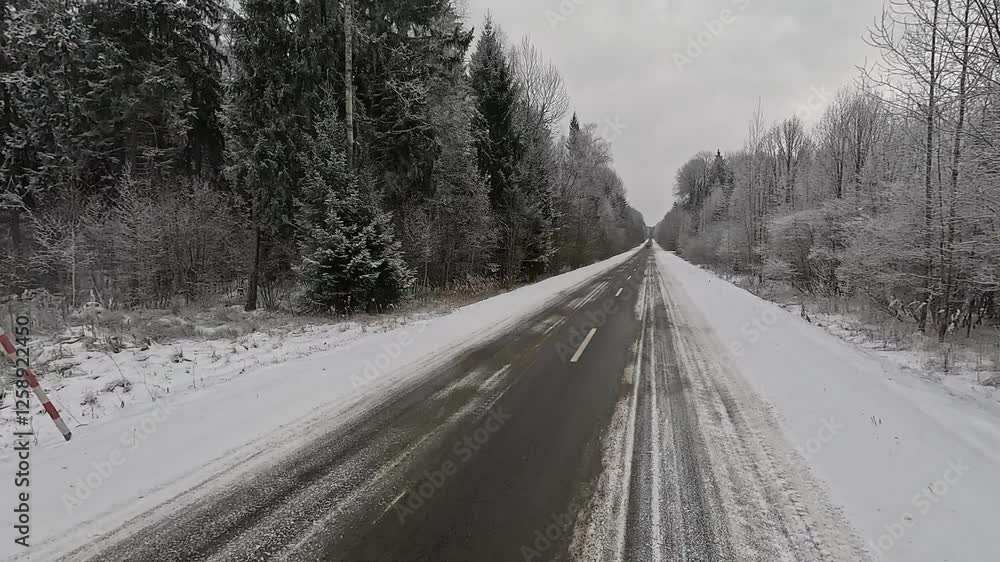 Winter road with snow, highway with cars on a sunny winter day. Winter landscape, road and shoulder covered with snow. Winter road with snow, highway with cars on a sunny winter day. Winter landscape, road and shoulder covered with snow.