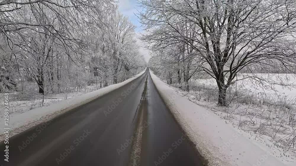 Winter road with snow, highway with cars on a sunny winter day. Winter landscape, road and shoulder covered with snow. Winter road with snow, highway with cars on a sunny winter day. Winter landscape, road and shoulder covered with snow.