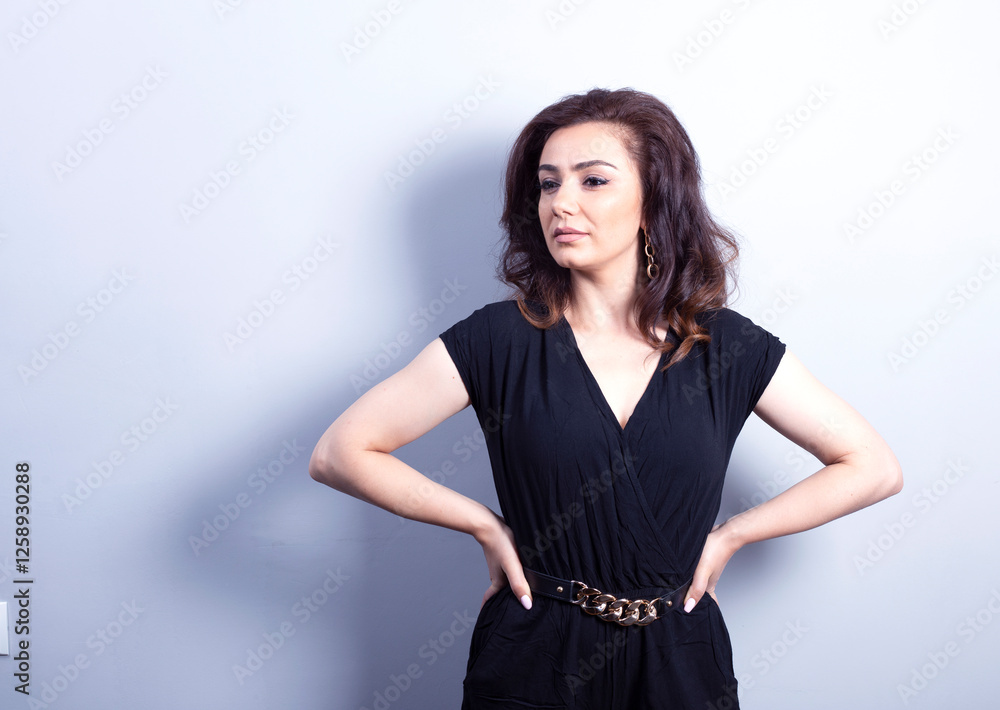 young beautiful woman in black dress in studio young beautiful woman in black dress in studio