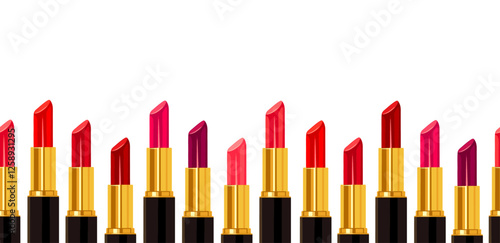 Seamless background with colored lipsticks in cartoon style. Vector illustration of lipstick tubes of different colors: pink, red, purple isolated on white background. Decorative cosmetic product. 