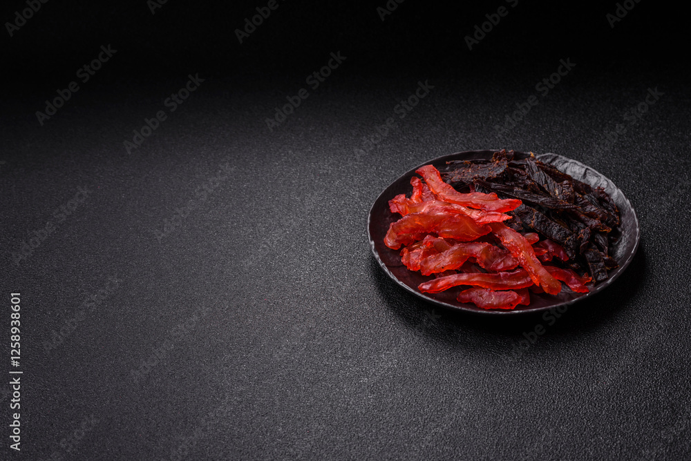 Jerky, dried chicken slices with salt and spices Jerky, dried chicken slices with salt and spices