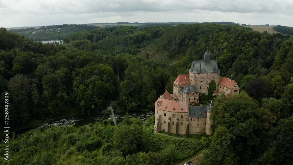 Aerial view Kriebstein Castle, medieval fortress perched on rocky cliff above Zschopau River in Saxony, Germany. Historic landmark showcases Germanys rich architectural heritag Aerial view Kriebstein Castle, medieval fortress perched on rocky cliff above Zschopau River in Saxony, Germany. Historic landmark showcases Germanys rich architectural heritag