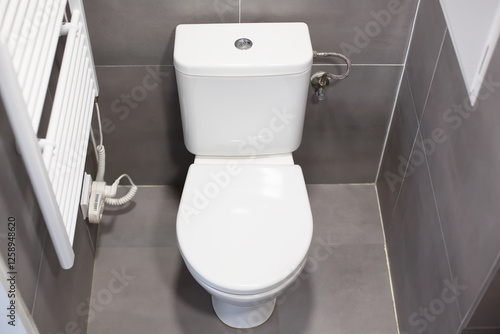 Toilet in a Small Bathroom with Gray Tile Design