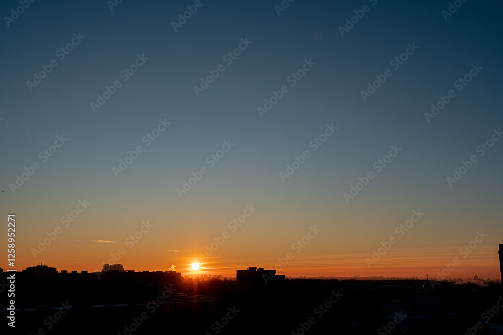 Dawn Breaks Over the City Skyline, Painting the Sky With Hues of Orange and Blue as a New Day Begins, Inviting Warmth and Opportunity. Dawn Breaks Over the City Skyline, Painting the Sky With Hues of Orange and Blue as a New Day Begins, Inviting Warmth and Opportunity.