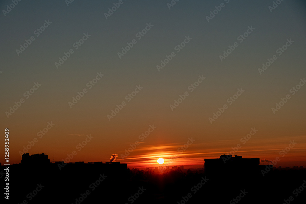 Vibrant Sunset Silhouettes With City Skyline Casting Shadows as the Sun Dips Below the Horizon, Creating a Captivating Display of Colors at Dusk. Vibrant Sunset Silhouettes With City Skyline Casting Shadows as the Sun Dips Below the Horizon, Creating a Captivating Display of Colors at Dusk.