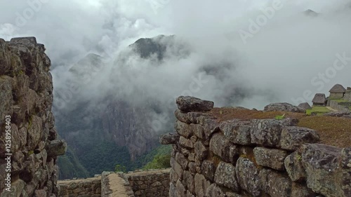 Machu Picchu ancient city view from Huchu'y Picchu in cloudy weather photo