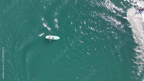 Dynamic aerial shots of jet skis and paddleboarding on turquoise waters – Adventure and motion