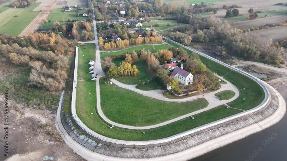 Top view of the church, buildings, trees, road and landscape in autumn. Top view of the church, buildings, trees, road and landscape in autumn.