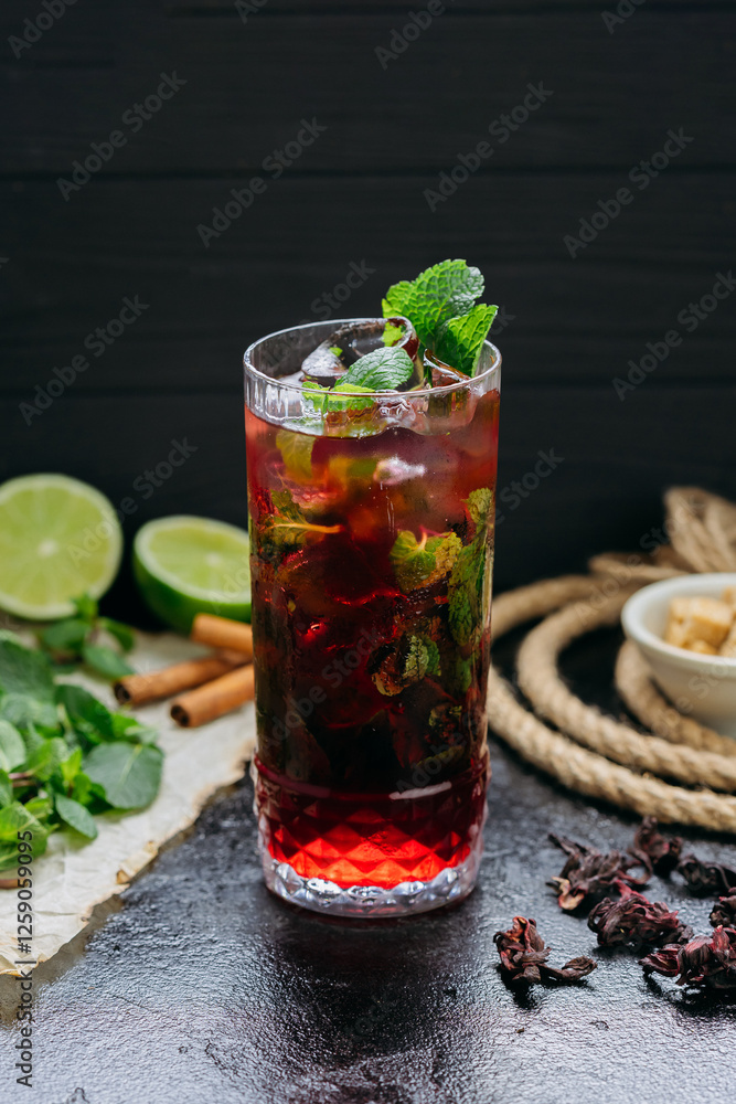Refreshing hibiscus cocktail with lime, mint, and ice in a tall glass, summer and tropical vibes Refreshing hibiscus cocktail with lime, mint, and ice in a tall glass, summer and tropical vibes