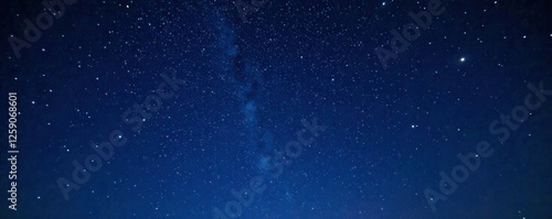 A starry night sky with twinkling stars against a dark blue black background, darkness, universe, galaxy