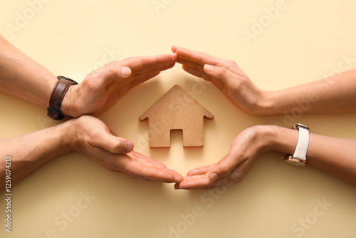 Hands of couple with house ...