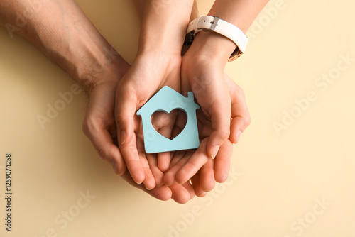 Couple holding house figure...