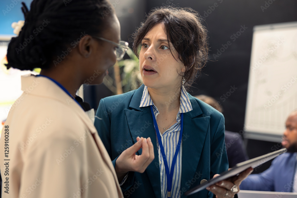 Business colleagues evaluating performance indicators within the company, conducting evaluations and discussing training programs. Workers enhancing productivity and efficiency. Business colleagues evaluating performance indicators within the company, conducting evaluations and discussing training programs. Workers enhancing productivity and efficiency.