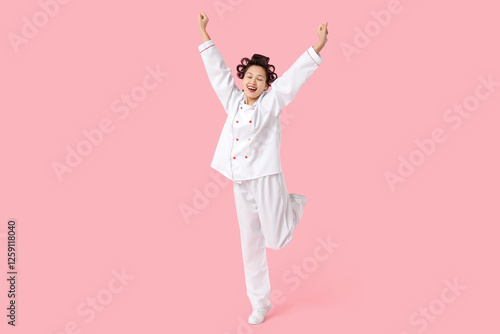 Happy female Asian chef wit...