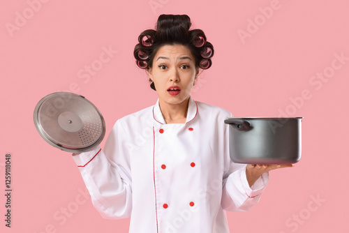 Shocked female Asian chef w...