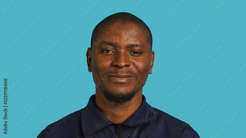 Joyful security guard working protection job presenting chroma key cellphone. Portrait of merry bodyguard showcasing isolated screen mobile phone, isolated over studio background, camera A Joyful security guard working protection job presenting chroma key cellphone. Portrait of merry bodyguard showcasing isolated screen mobile phone, isolated over studio background, camera A