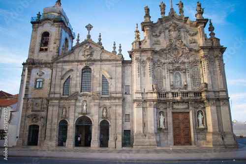 Historic baroque church facade in Porto  Portugal  under blue sky.