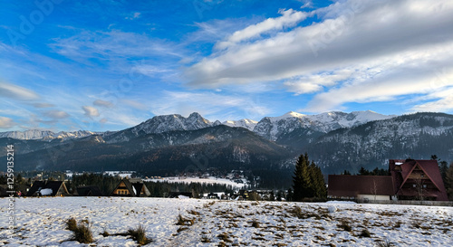 View of Mount Giewont and the Tatra Mountains in winter. Mountain landscape from the side of the village of Koscielisko  photo