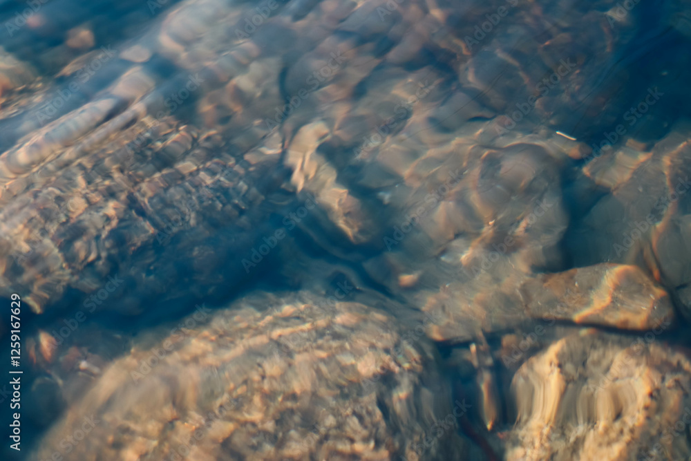 Abstract motion blur of water in the mountain river. Natural background. Abstract motion blur of water in the mountain river. Natural background.