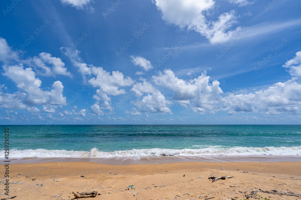 Fototapeta premium Empty tropical beach and seascape, Beautiful sandy beach and sea in sunny day,Blue sky in good weather day, Beach sea space area nature background