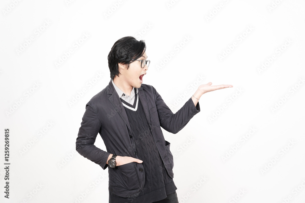 Shocked face Showing and Presenting Product on Open Palm Of Handsome Asian Man Isolated On White Background Shocked face Showing and Presenting Product on Open Palm Of Handsome Asian Man Isolated On White Background