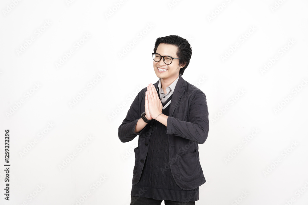 Smiling and doing Namaste hand Sign Greeting Of Handsome Asian Man Isolated On White Background Smiling and doing Namaste hand Sign Greeting Of Handsome Asian Man Isolated On White Background