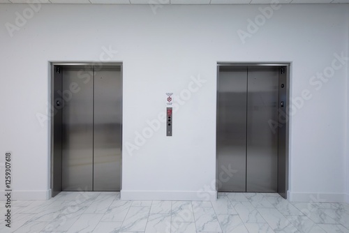 Wallpaper Mural White wall and two elevator stainless steel doors and white marble floor Torontodigital.ca