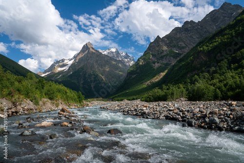 Fototapeta Naklejka Na Ścianę i Meble -  View of the Dombay-Ulgen gorge in the mountains of the North Caucasus near the village of Dombay on a sunny summer day, Karachay-Cherkessia, Russia