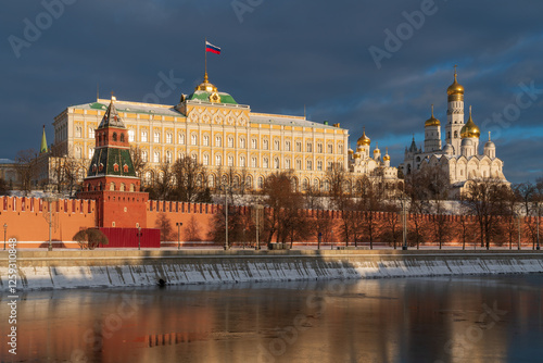 View of the building of the Grand Kremlin Palace, the Annunciation Tower and the ensemble of the Kremlin Cathedral Square from the embankment of the Moskva River, Moscow, Russia