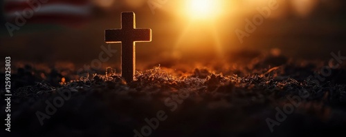 Golden Cross Silhouette on Earth Mound Radiating Divine Light a Beacon of Faith and Spiritual Hope photo