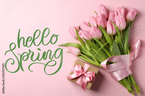Hello spring, gift box and pink tulips on pink background, top view, with text photo