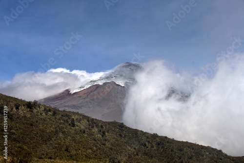 Clouds blowing over Cotopaxi Volcano, which is erupting with a small ash plume, in Cotopaxi National Park, outside of Machachi, Ecuador