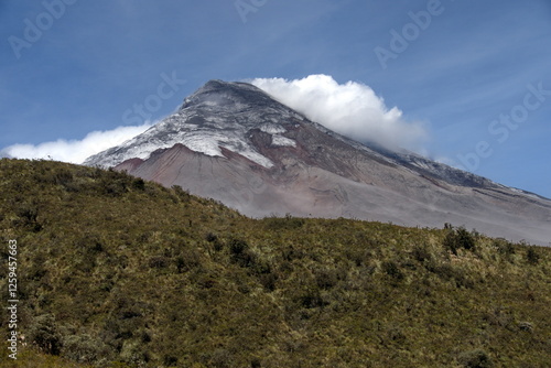 Cotopaxi Volcano erupting with a small ash plume, in Cotopaxi National Park, outside of Machachi, Ecuador