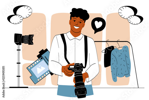 Smiling photographer holding a camera in a creative studio. 