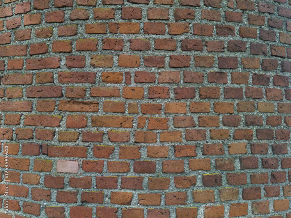 An old brick wall. Brickwork. Background of brown stones. The texture of the brick. An old brick wall. Brickwork. Background of brown stones. The texture of the brick.