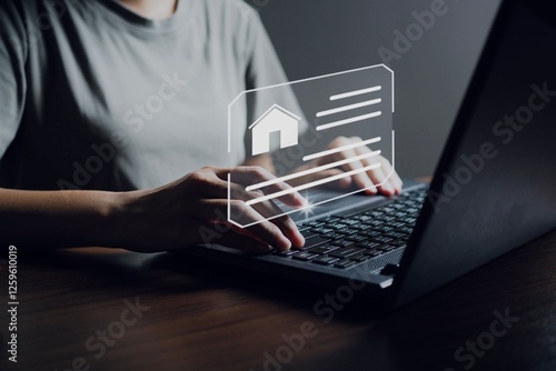 Business woman use a computer to find information about buying and selling a house.