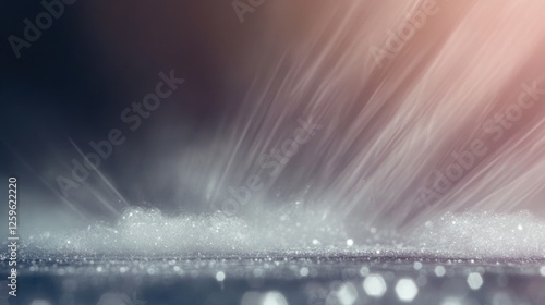 Silver Glitter Rays: A dramatic abstract photo featuring a silver glitter surface, illuminated by warm, sun-like rays, creating a stunning, almost ethereal effect.  