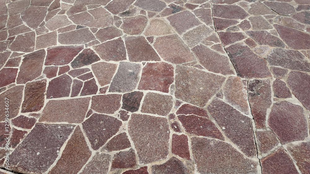 Stone pathway design with various textures and colors in sunlight Stone pathway design with various textures and colors in sunlight