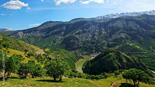 Stunning mountain village nestled in lush green hills under a clear sky.
📍Selin village, Hawraman Takht - Kurdistan 