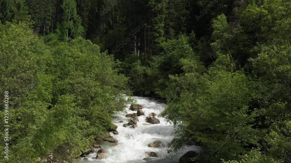Flying in the Alps low over a mountain river, Italy. Mountain rivers of Italy Flying in the Alps low over a mountain river, Italy. Mountain rivers of Italy