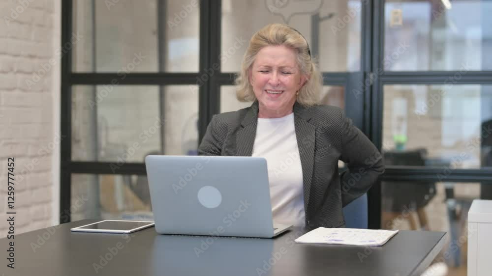 Senior Old Business Woman having Back Fatigue and Pain in Office Senior Old Business Woman having Back Fatigue and Pain in Office