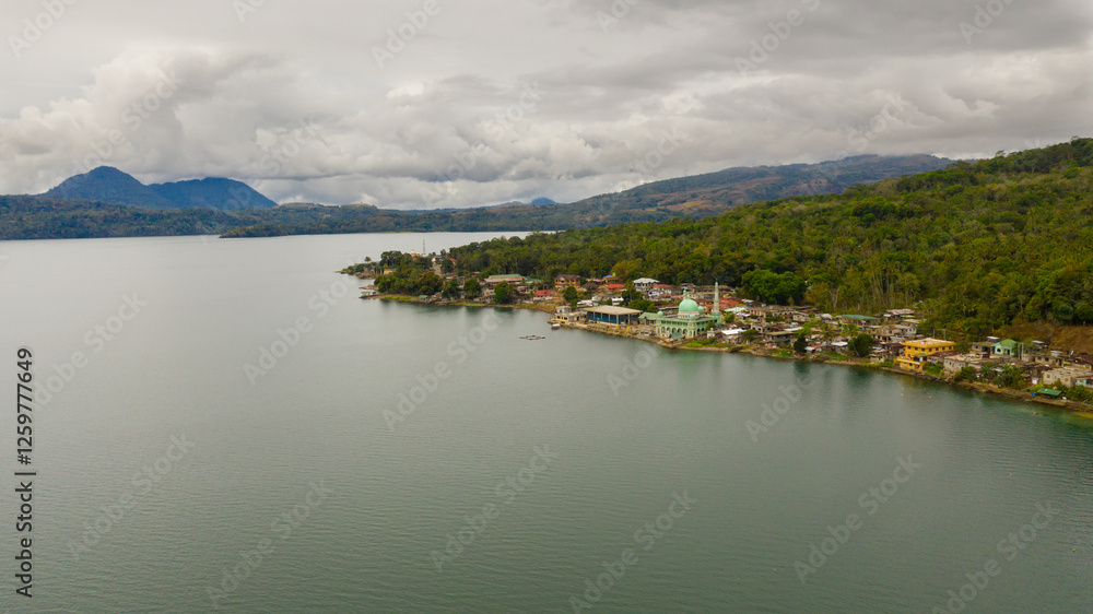 Aerial drone of Mosque on the shore of lake Lanao. Mindanao, Lanao del Sur, Philippines. Aerial drone of Mosque on the shore of lake Lanao. Mindanao, Lanao del Sur, Philippines.