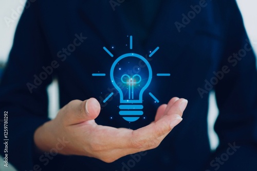 Creative thinking is the key to success. Woman holding light bulb symbol. Creative business thinking concept.