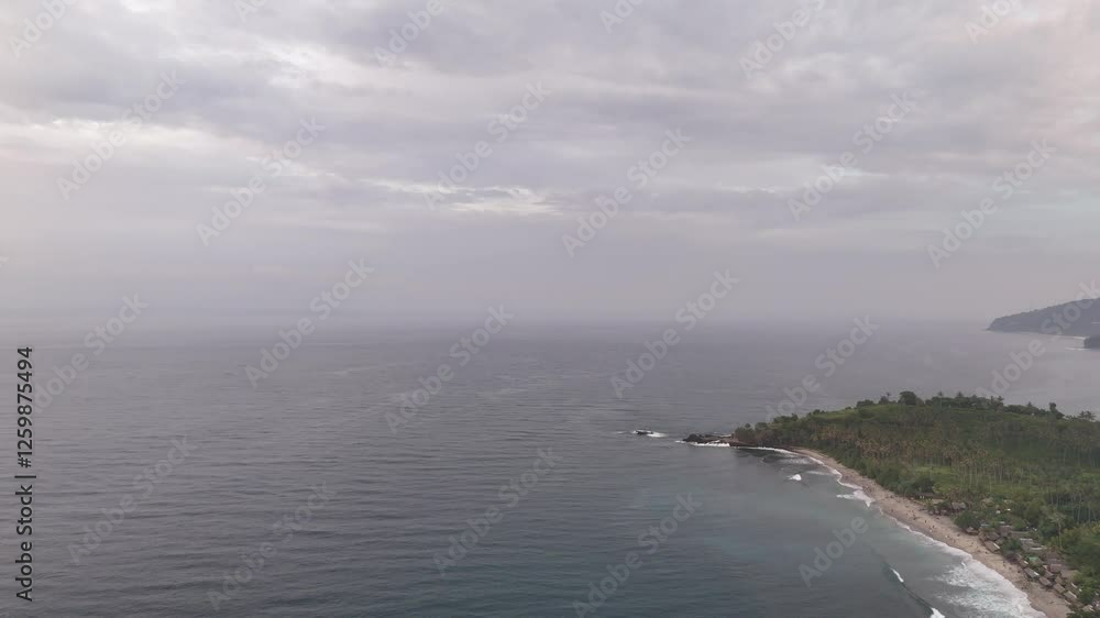 Breathtaking Sunset at Senggigi Beach, Lombok with Lighthouse and Coconut Trees Breathtaking Sunset at Senggigi Beach, Lombok with Lighthouse and Coconut Trees