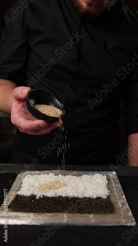 chef prepares delicious Japanese rolls
