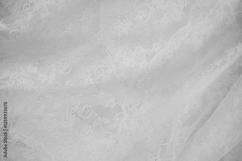 Naklejka premium Delicate white lace fabric draped beautifully for textile design