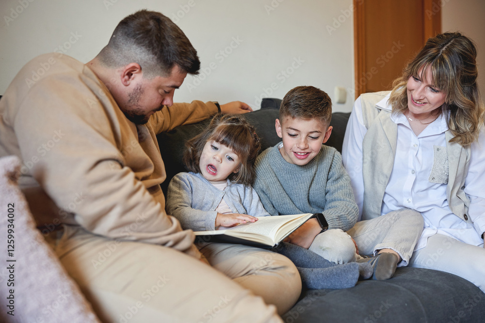 Loving family reading a book together on the couch at home Loving family reading a book together on the couch at home