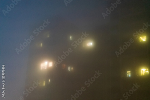 At night, the city shrouded in fog
