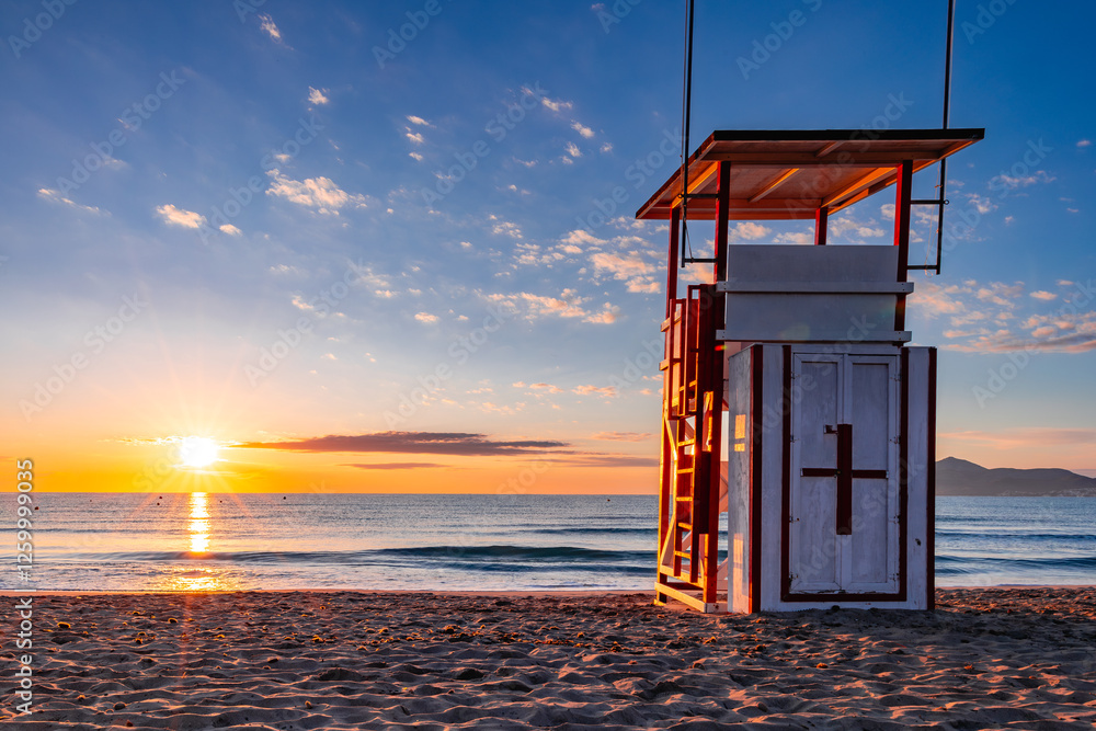 lifeguard tower at sunset