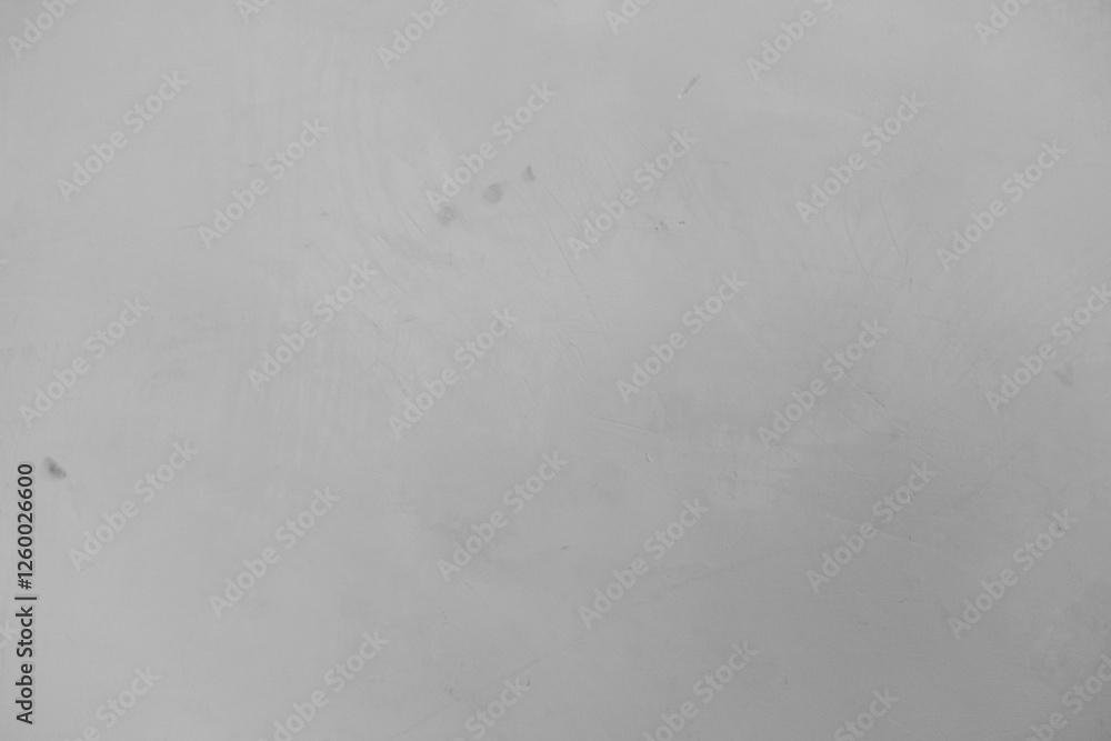 A soft gray surface displaying a minimalistic texture with faint markings A soft gray surface displaying a minimalistic texture with faint markings